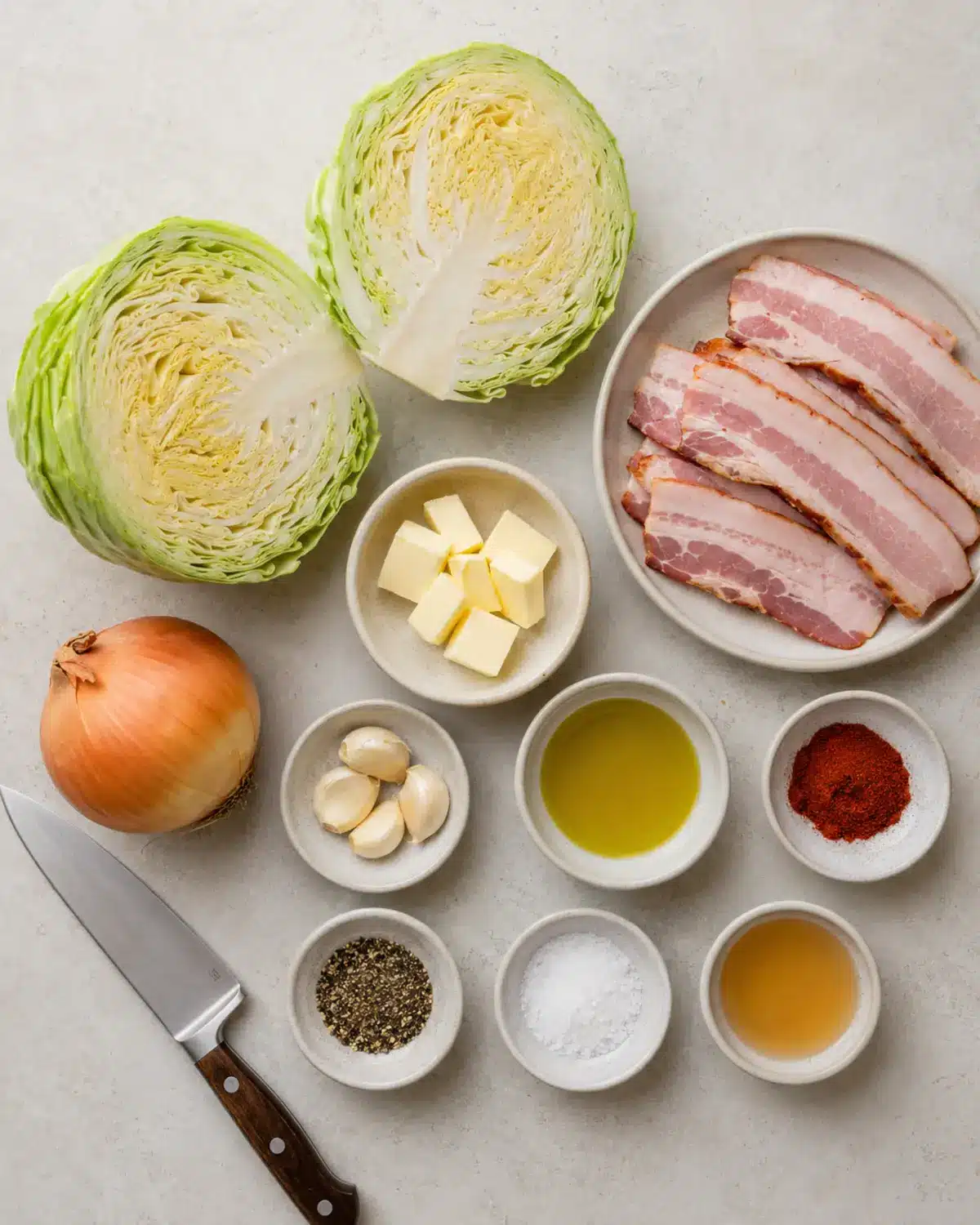 Easy Fried Cabbage Recipe with Bacon 2 Ingredients for easy fried cabbage arranged on a light counter