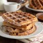 Stack of churro waffles coated in cinnamon sugar