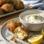 Served potato bombs with yogurt dip