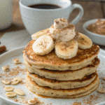 Banana cottage cheese pancakes stacked in a rustic French kitchen